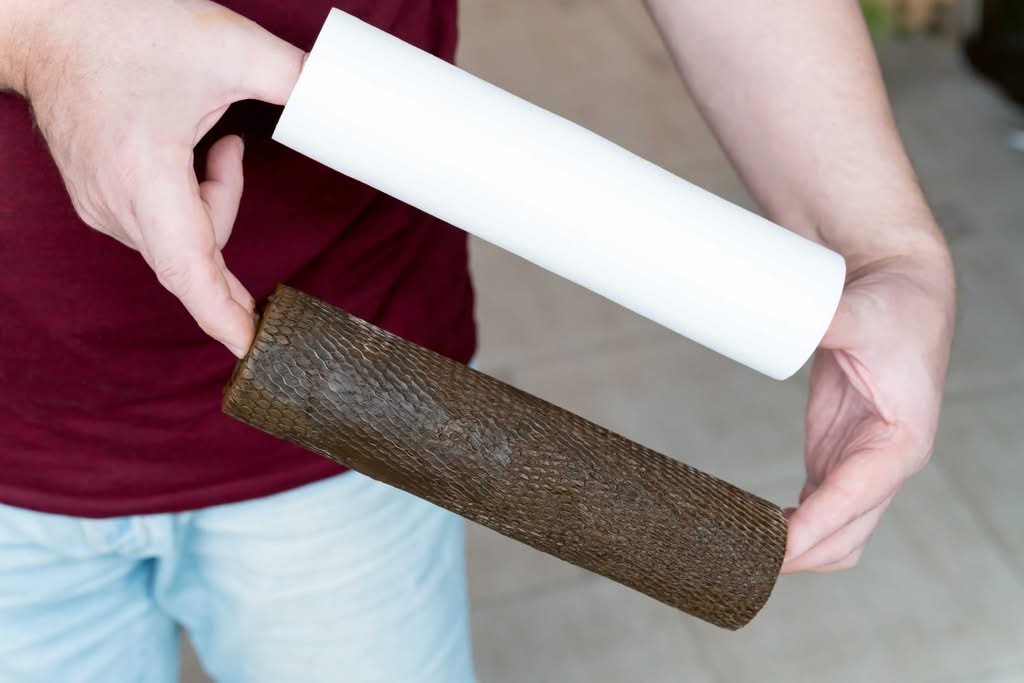 Professional Pool Filter Cleaning Services in The Villages: Ultimate Guide 2 Side-By-Side Comparison Of A Person Holding A Brand New White Sediment Water Filter Cartridge Next To A Heavily Used, Dark Brown, Sludge-Covered Filter.
