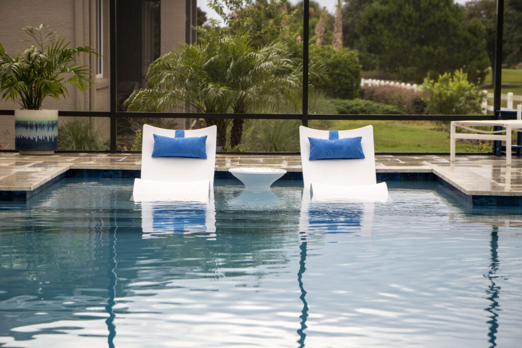 Choosing the Right Pool Company in Ocala & The Villages (2026 Guide) 3 Family Reviewing Pool Financing Options With Pool Company Representative