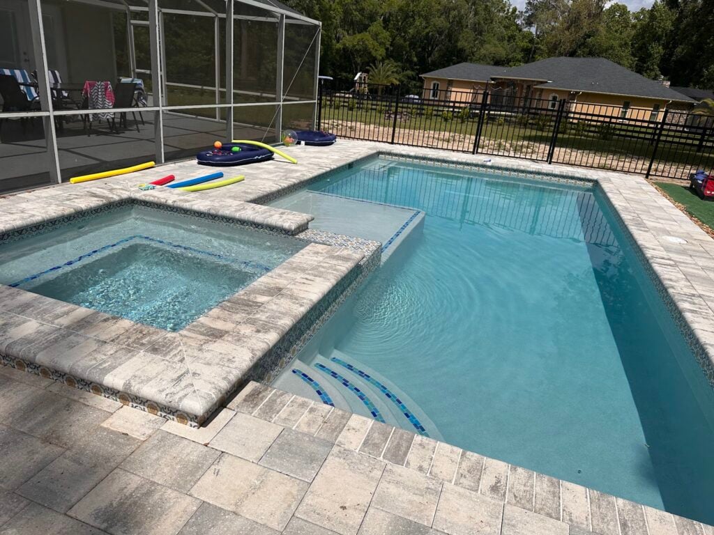 Finding Reliable Pool Equipment Repair Near Me in Ocala & The Villages 1 Technician Performing Pool Equipment Repair Near Me On A Backyard Pump Pad In Ocala